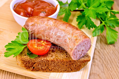 Sausages fried on bread with tomato