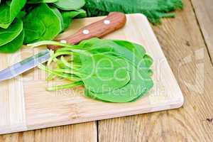 Spinach with knife on board