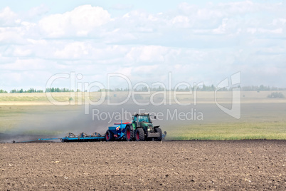 Tractor working on arable land