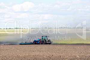 Tractor working on arable land