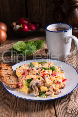 Scrambled eggs with tomatoes and spinach