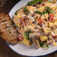 Scrambled eggs with tomatoes and spinach