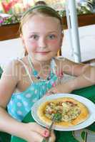 girl eating pizza