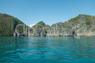 Scenic View of Rocky Coastline and Lush Mountains