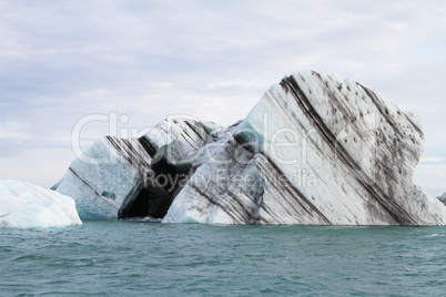 Heart seen in a Iceberg Floating in Jokulsarlon Under Overcast Sky