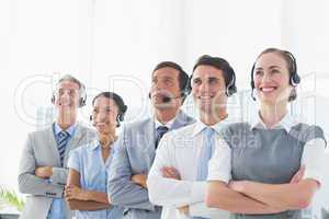 Business people with headsets looking at top