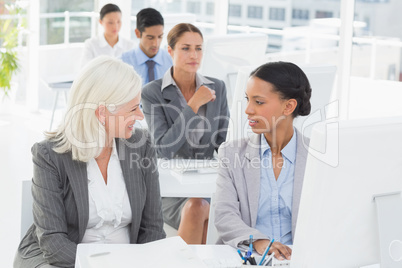 Businesswoman checking her colleagues works