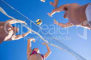 Group of friends playing volleyball