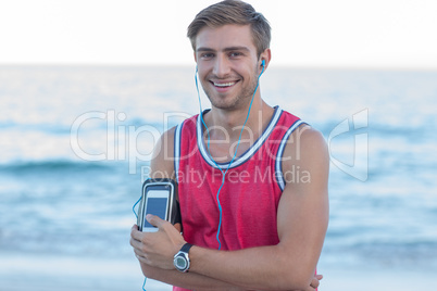 Handsome runner looking at camera