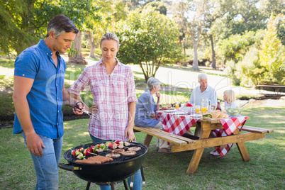 Happy family having picnic in the park