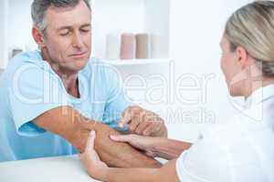 Doctor doing arm massage