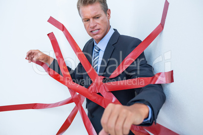 Businessman trapped by red tape