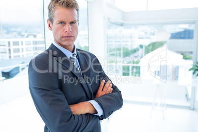 Serious businessman looking at camera