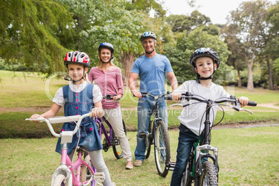 Happy family on their bike at the park