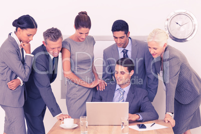 Business people using laptop