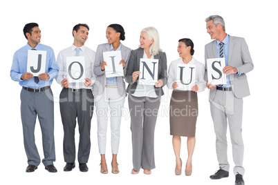 Business people holding letters sign