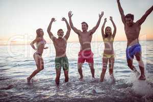 Happy friends having fun in the water