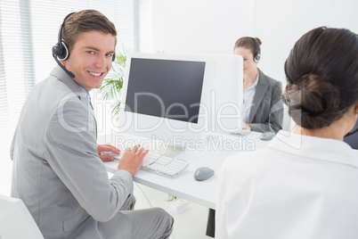 Smiling businessman wearing headset