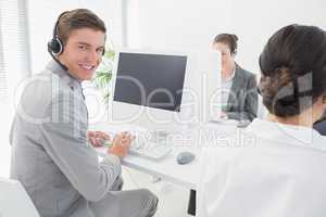 Smiling businessman wearing headset