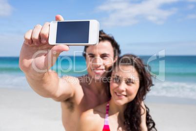 Happy couple taking selfie Happy couple taking selfie