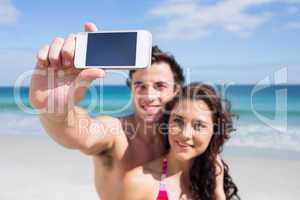 Happy couple taking selfie