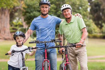 Happy multi generation family on their bike at the park