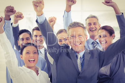 Business people cheering in office