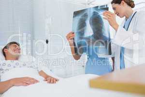 Doctors examining patients xray