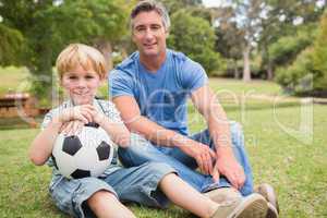 Happy father with his son at the park