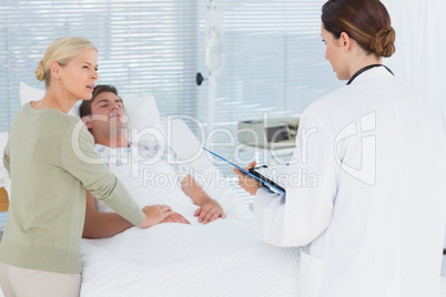 Doctor talking with her patients mother Doctor talking with her patients mother