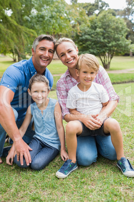 Happy family smiling at the camera