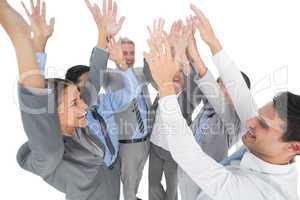 Business people raising their arms