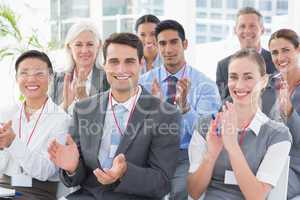Business people applauding during meeting