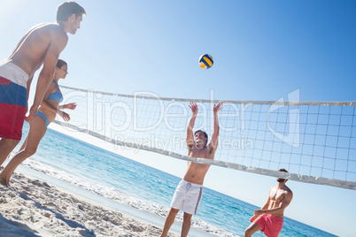 Friends playing volleyball