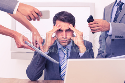 Worried businessman with head in hands