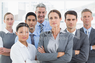 Business people looking at camera with arms crossed