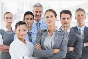 Business people looking at camera with arms crossed