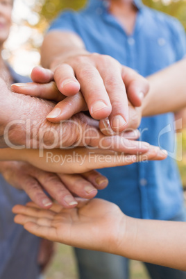 Family putting their hands together