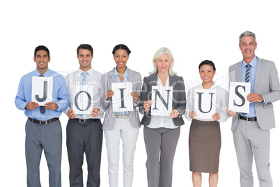 Business people holding letters sign