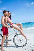 Happy couple going on a bike ride