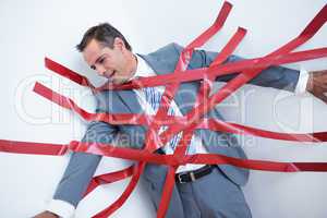 Businessman trapped by red tape