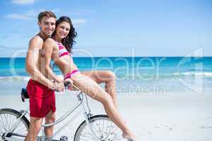 Happy couple going on a bike ride