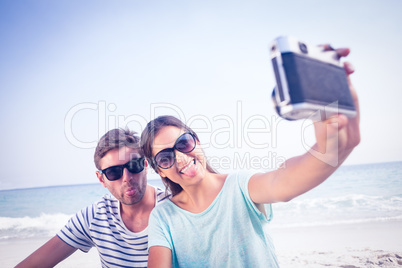 happy couple taking selfie