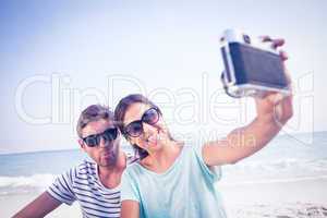 happy couple taking selfie