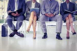 Business people waiting to be called into interview