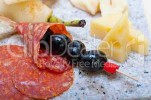 mix cold cut on a stone with fresh pears