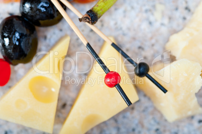 mix cold cut on a stone with fresh pears