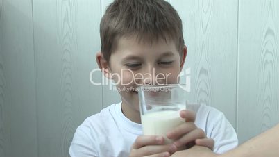 Funny yogurt left a footprint on the boy's lips
