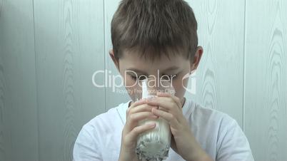 Funny yogurt left a footprint on the boy's lips