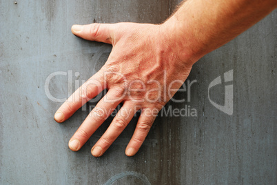 Male Hand Against Grey Background